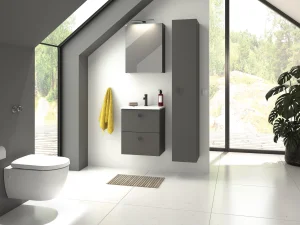 Modern bathroom with grey wall-hung vanity and tall cabinet, white sink and black faucet, yellow towel, slanted skylight and large glass walls with a potted plant.