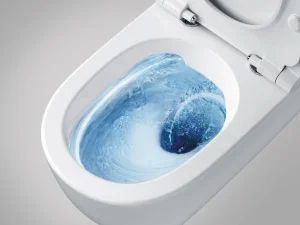 White toilet with the lid open; blue-tinted water swirls in the bowl during a flush.