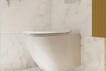 Modern wall-mounted white toilet with closed lid on marble walls and floor; gold toilet roll holder, dual-flush panel, and wooden slat detail.