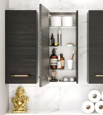 Row of white freestanding cabinets with open doors displaying bottles, jars, towels and toiletries on shelves against a pale wall and wooden floor.