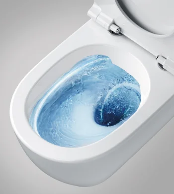 White toilet with the lid open; blue-tinted water swirls in the bowl during a flush.