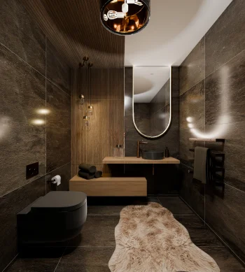 Dark stone bathroom with a floating wooden vanity, black toilet, oval backlit mirror, copper tap, pendant lights and a long beige faux fur rug.