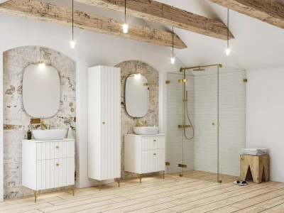 Bright bathroom with rustic wooden ceiling beams, arched stone alcoves, white vanities with brass hardware, oval mirrors, vessel sinks, and a glass shower enclosure.