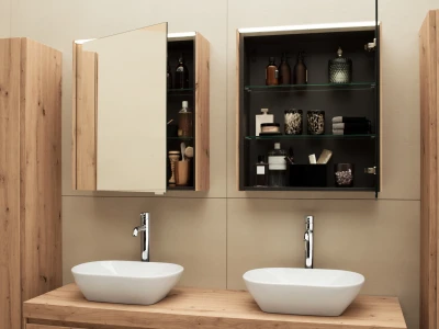 Two white oval basins sit on a wooden counter; chrome taps, flanked by cabinets. Left cabinet open with brushes, right shelves bottles and towels.