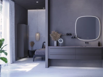 Minimalist grey bedroom with a backlit rounded-square mirror above a sleek vanity, a partitioned alcove bed, and plants by white floors and sheer curtains.