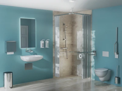 Modern blue bathroom with a wall-mounted white sink, backlit rectangular mirror, two soap dispensers, wall-mounted toilet, grab bar, and a curved shower with beige tiles and a light curtain.