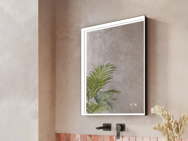 Modern bathroom with white floating vanity, square vessel sink, black wall-mounted faucet, pink tiles, beige walls, mirror and pampas grass vase.