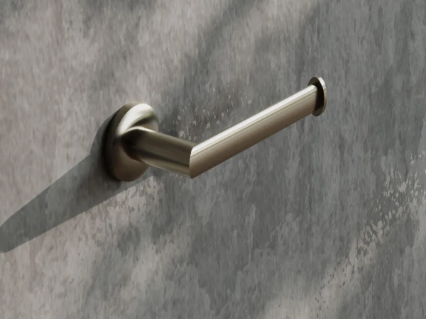 Close-up of a brushed metal door lever with a circular mounting plate on a grey, marbled wall, casting a soft shadow.