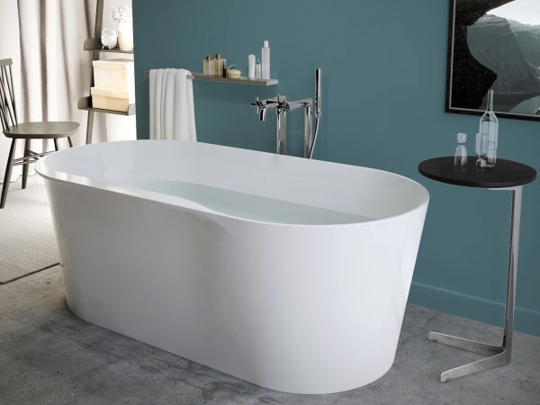 Modern bathroom with a freestanding bathtub filled with water, teal wall, chrome fixtures, and a black table with glass bottles; landscape photo.